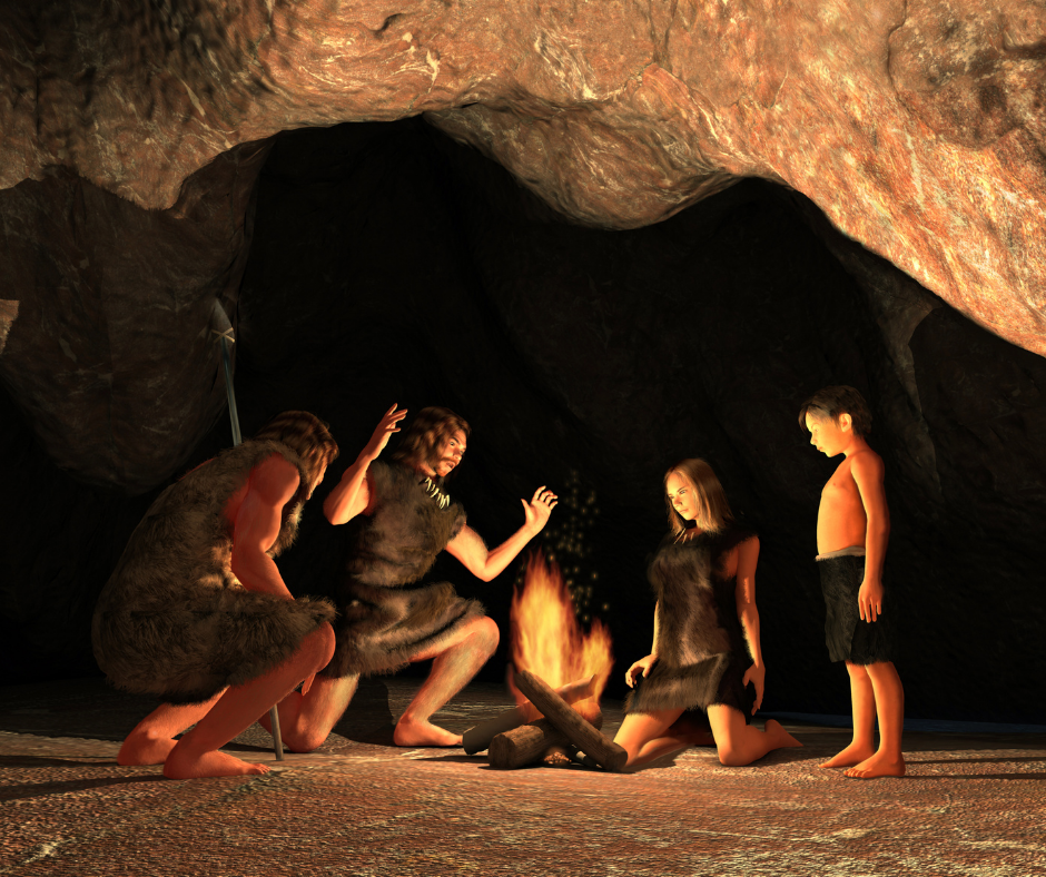 Prehistoric family around a fire in a cave